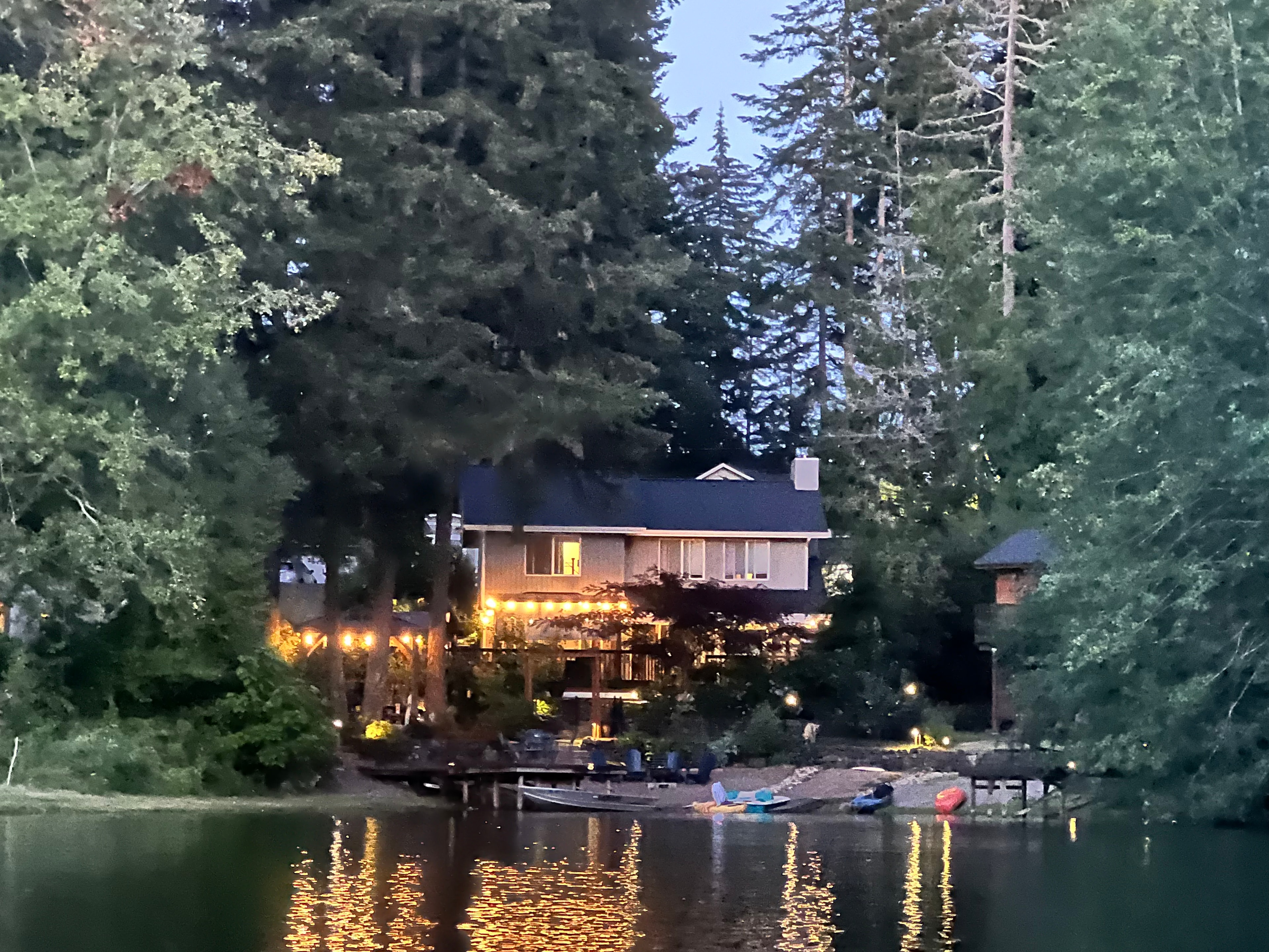 An evening view of our former waterfront home, photographed from my kayak